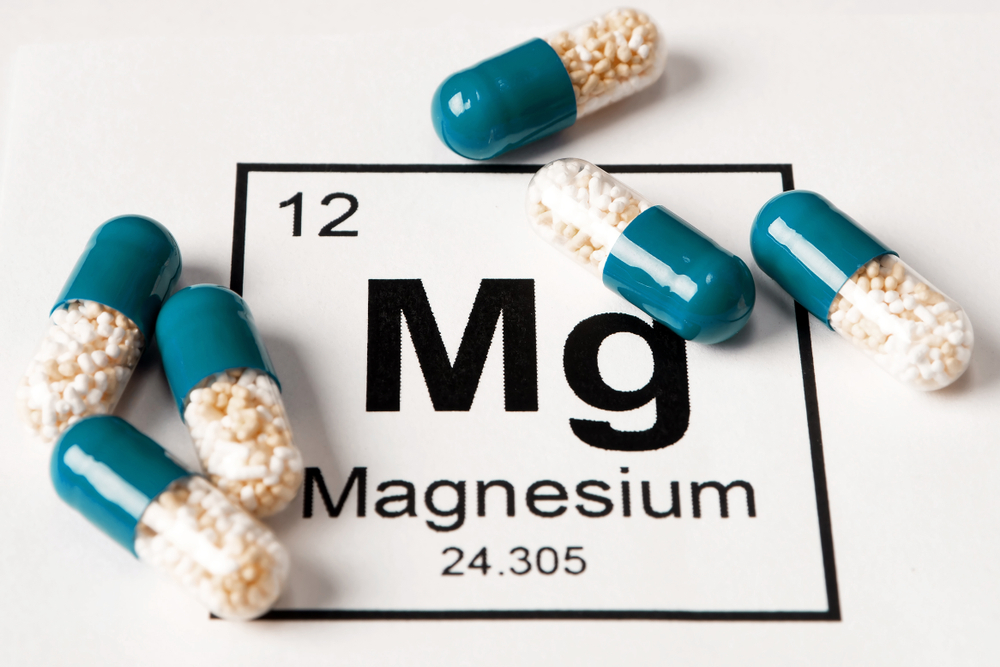 Pills,with,mineral,mg,(magnesium),on,a,white,background,with Pills,with,mineral,mg,(magnesium),on,a,white,background,with